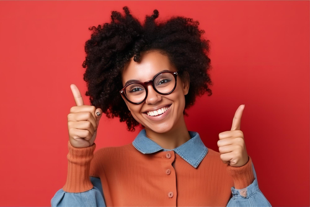 woman-with-glasses-blue-shirt-gives-thumbs-up